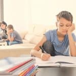 Kids Doing School Homework At Home. Mother Helping Her Teenager Son With Homework. Online Learning,