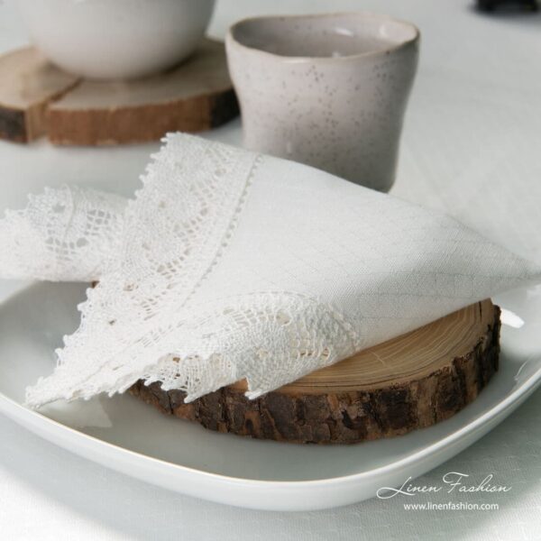White colored linen napkin with hole pattern.