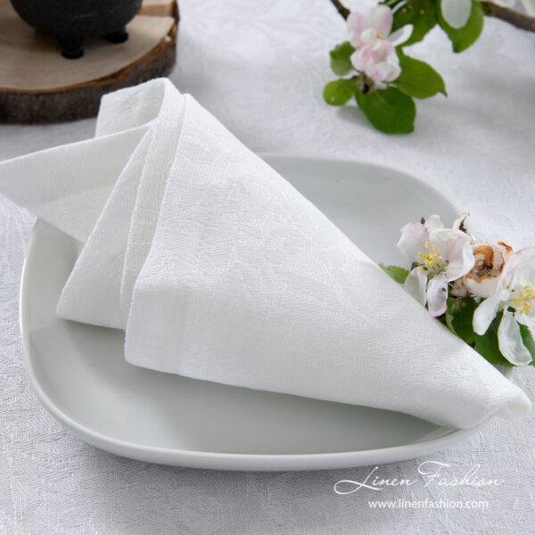 White linen napkin with flower ornaments