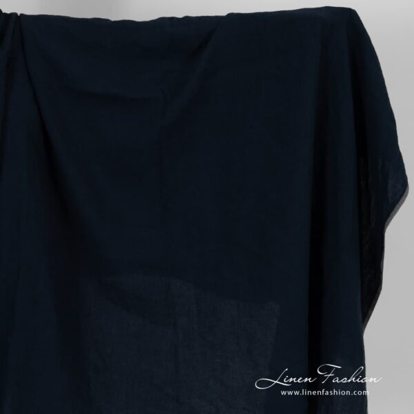 Linen fabric in blue black colour, washed.