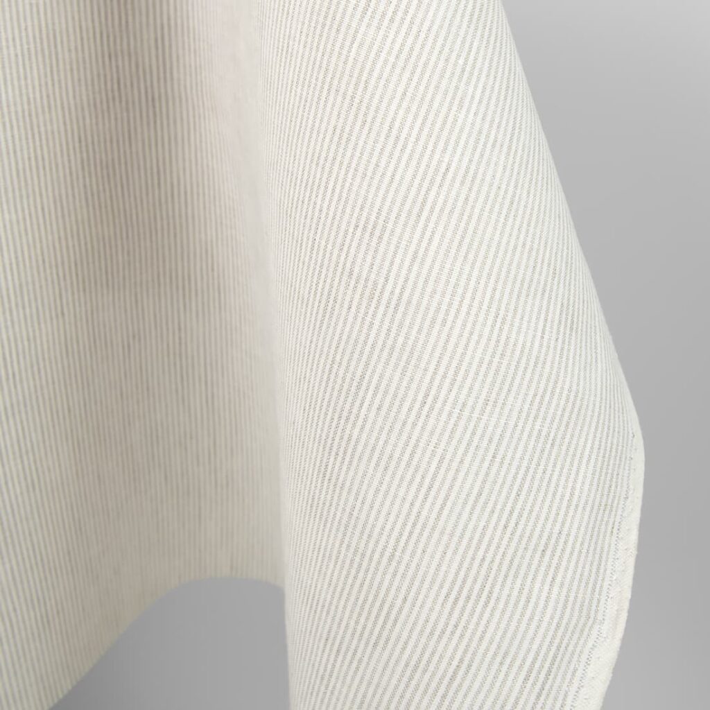 Tissu de lin à rayures naturelles et blanches 2 Linen fabric in natural and white colour stripes close up edge photo