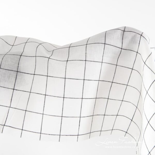 Off-white linen fabric with black grids.