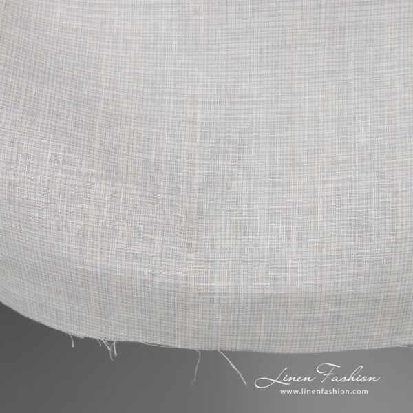 Wide linen fabric greyish white colour edge view