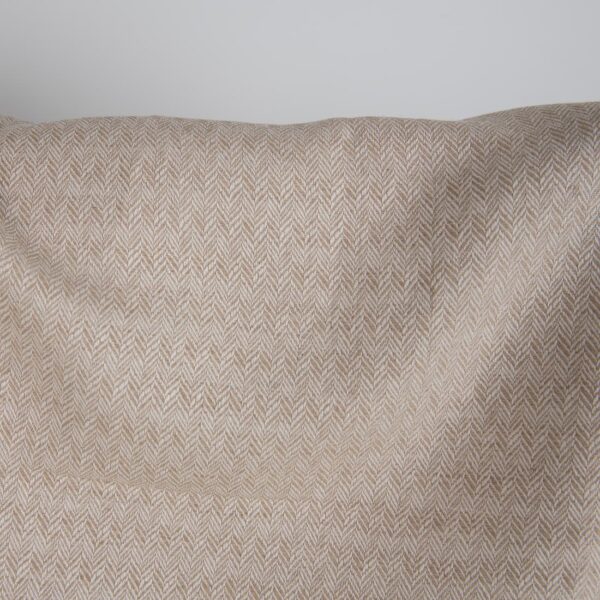 Brown and white linen cotton fabric in a herringbone pattern close up detail