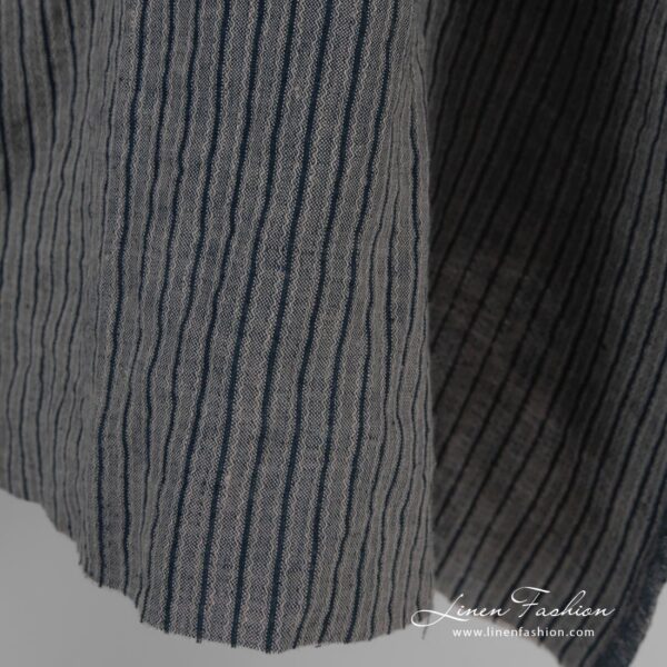 Linen jacquard fabric in black stripes, specially washed to increase softness