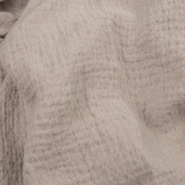 Light grey linen fabric with a diamond pattern washed