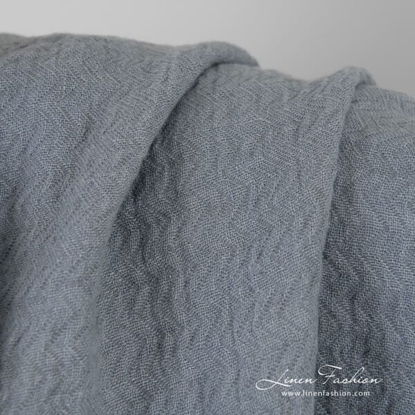 Bluish grey jacquard linen fabric in zigzag pattern, specially washed to increase softness