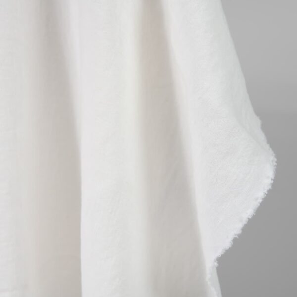 Washed heavy linen fabric off-white colour edge view