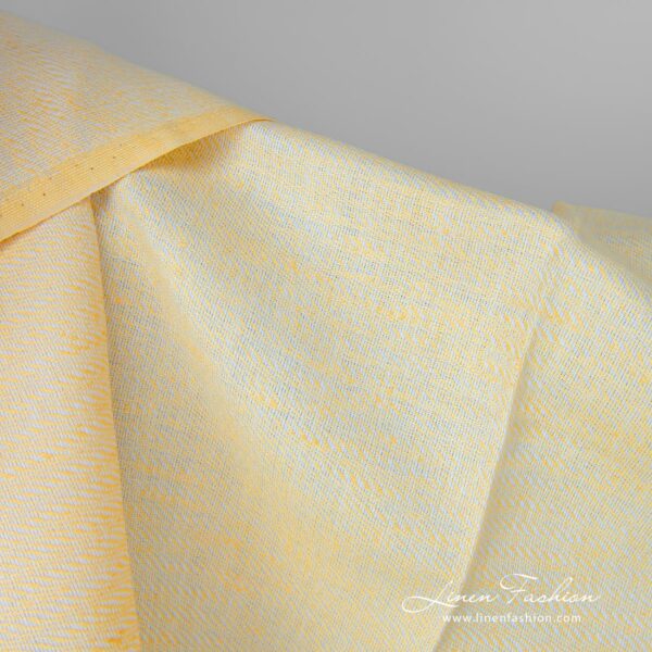 Linen cotton fabric yellow white small pattern close up detail