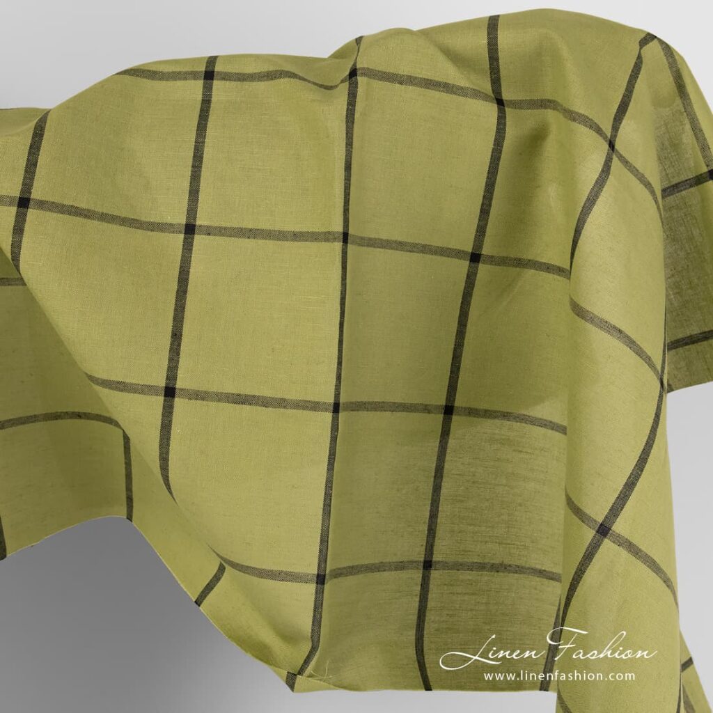 Tissu en coton lin vert clair avec des grilles noires 1 Light green linen cotton fabric with black grids.