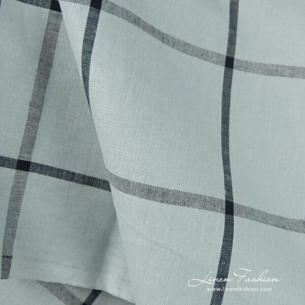 Pale blue dyed linen cotton fabric in checks,
