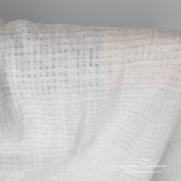 Light grey linen fabric with openwork stripes, which forms 1cm x 1cm (0.39”x0.39”) size checks