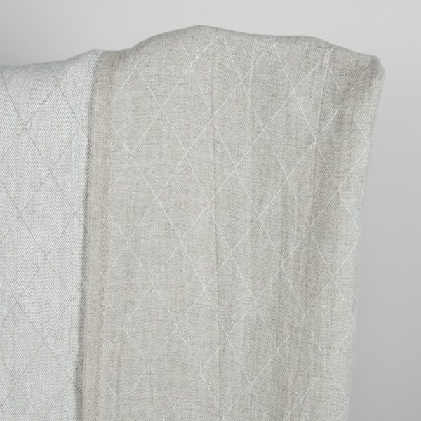 Grey double-sided washed linen fabric with a pattern darker side