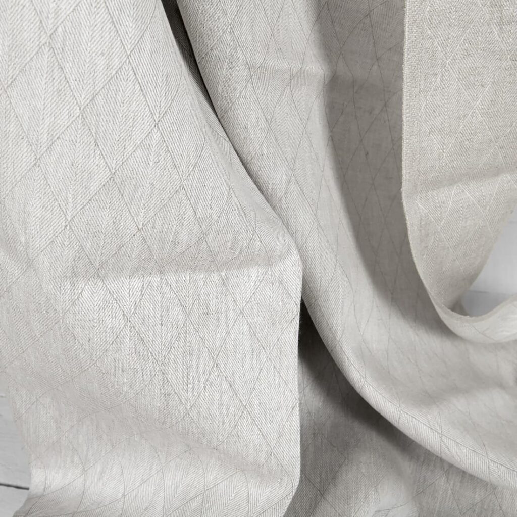 Tissu en lin beige double face à motif de losanges 2 Beige double-sided linen fabric in a diamond pattern texture