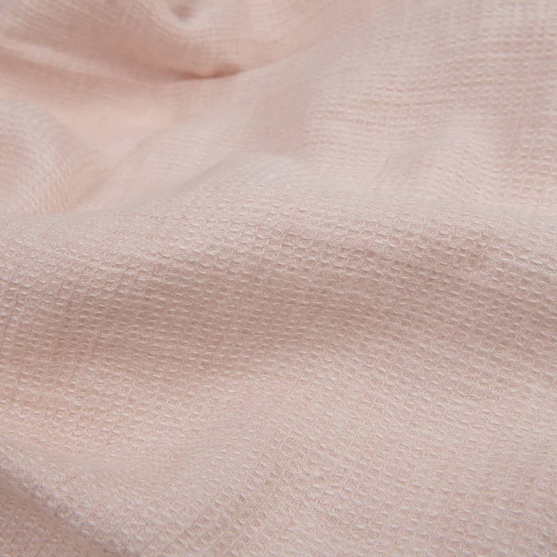 Tissu de lin gaufré rose pâle lavé