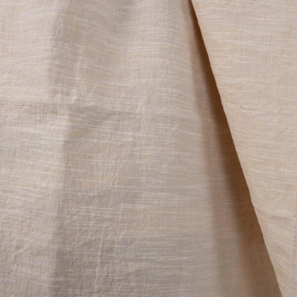 Washed linen cotton fabric yellowish pink colour close up detail