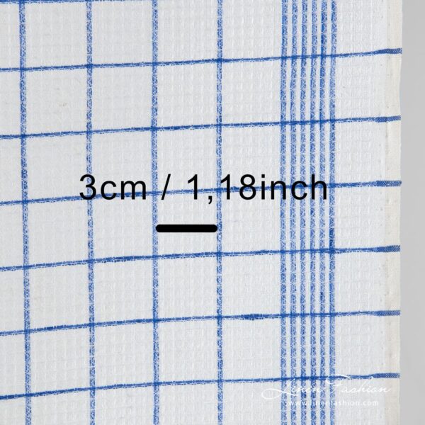 Off white linen fabric in blue checks.