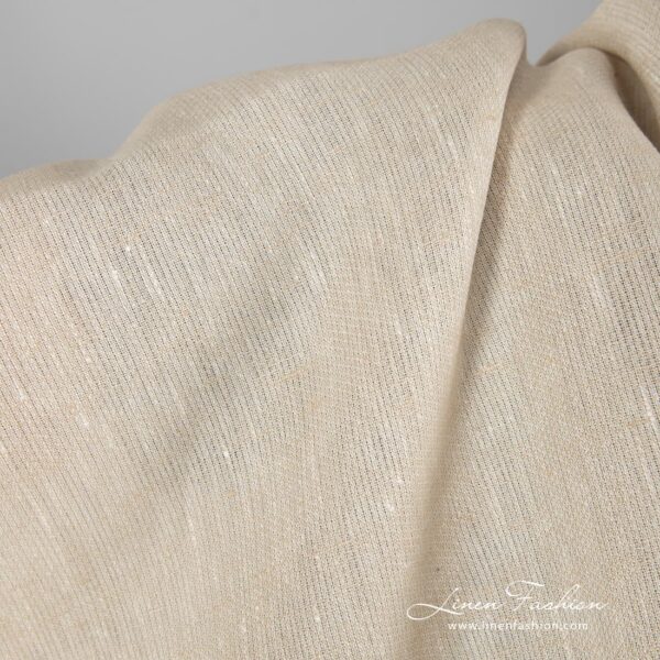 Patterned linen fabric in light sand colour.