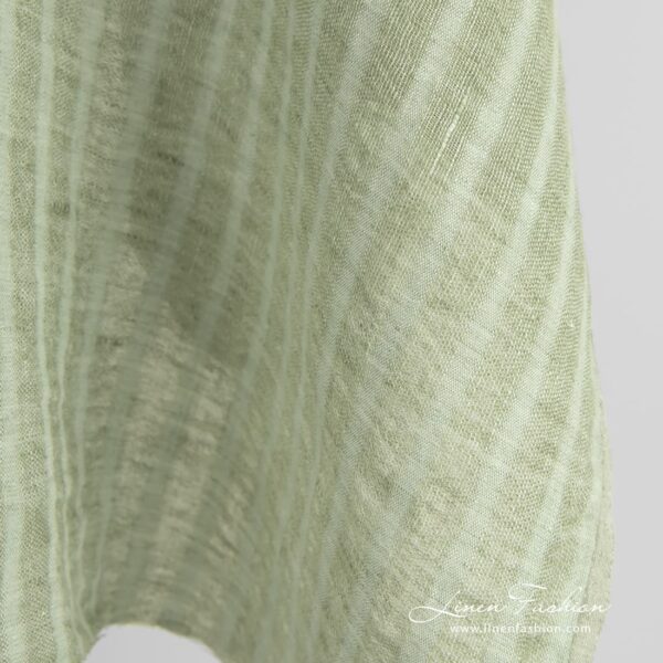 Green linen fabric in transparent vertical stripes