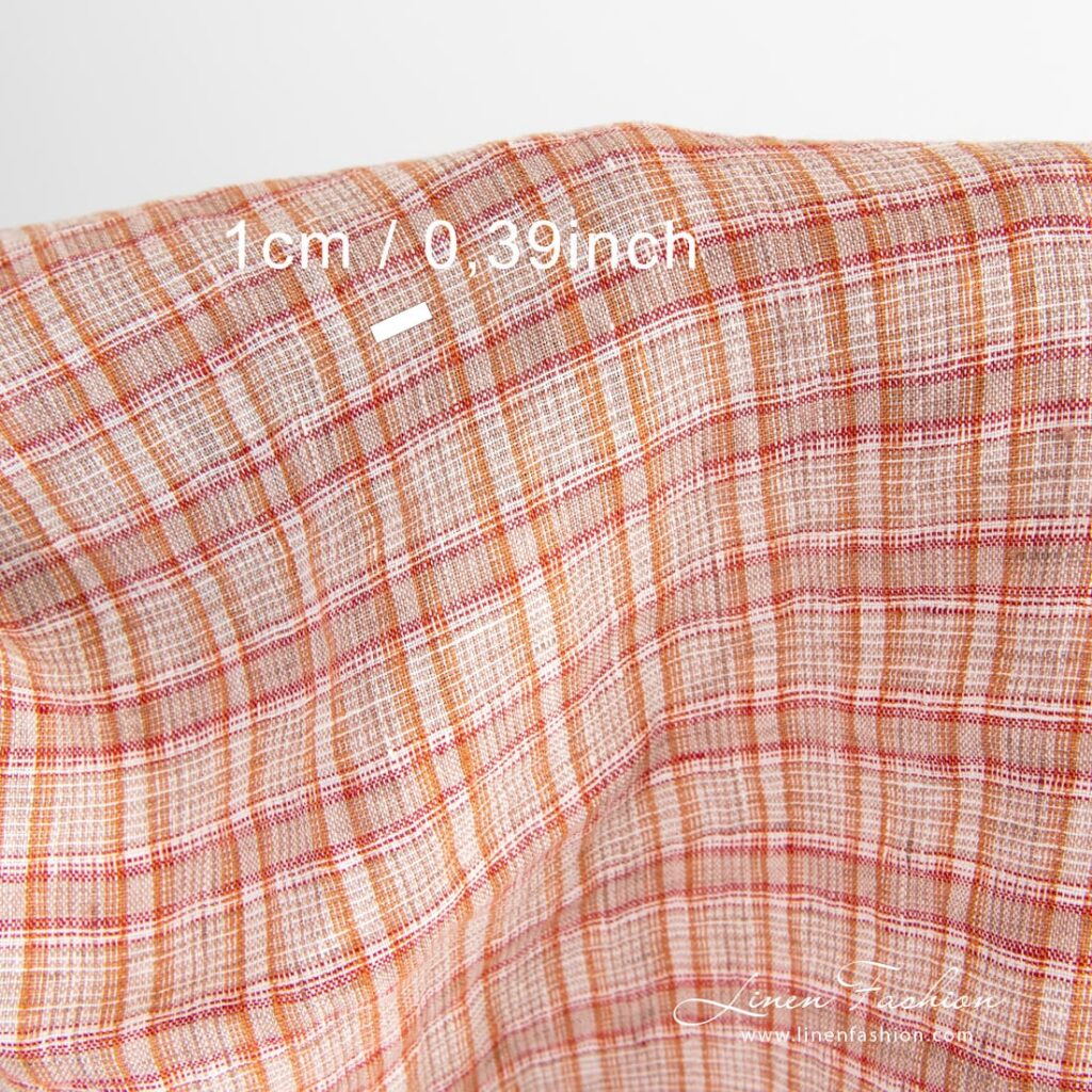 Tissu de lin orange à carreaux lavés 4 Checked linen fabric woven in white, orange, brown and red yarns