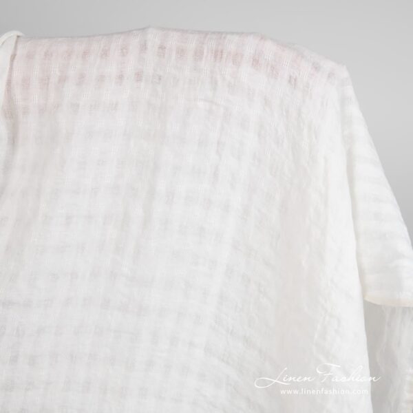 Off-white linen fabric in transparent checks, washed