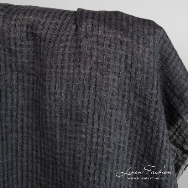 Dark grey linen fabric in transparent checks, specially washed to increase softness