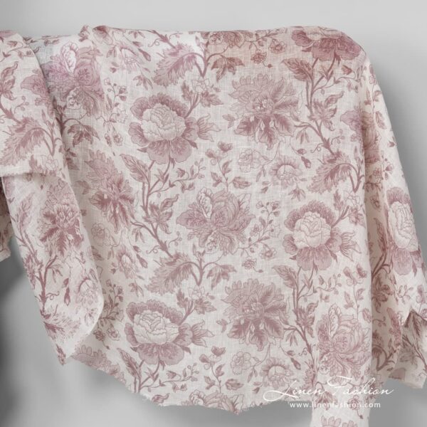 Gauzy linen fabric with printed rosy flower pattern.