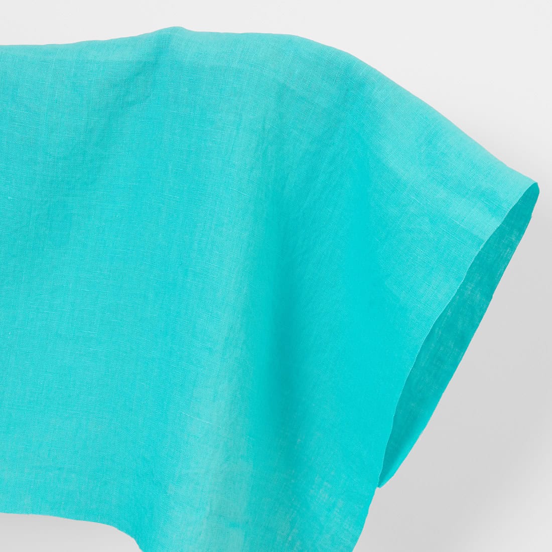 Linen fabric in cyan, washed