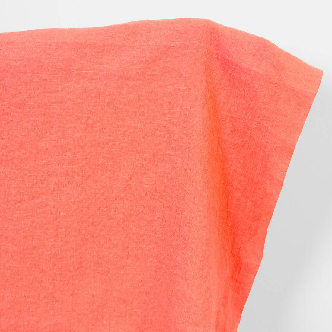 Linen fabric in living coral, washed