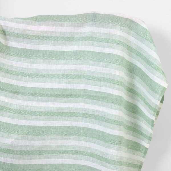 Linen fabric in pale green and white herringbone stripes