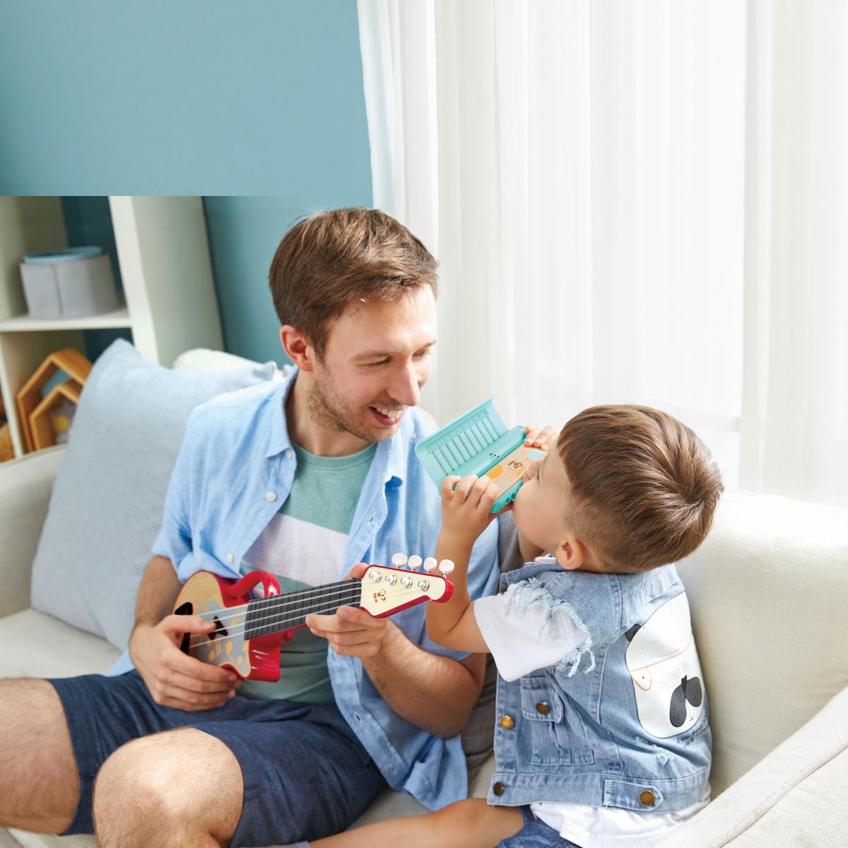 Ukelele luminoso Teach Yourself Hape rojo