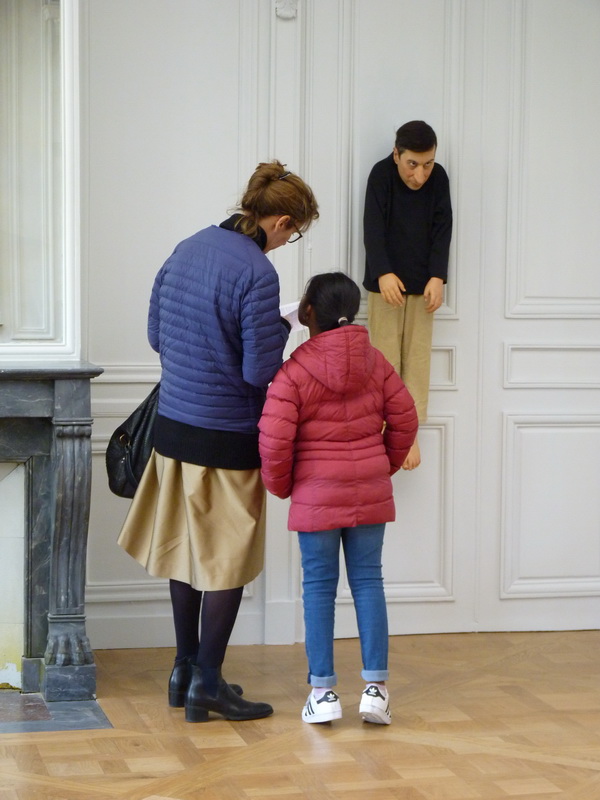 p1570750-4-maurizio-cattelan-we-68x148x78-7cm-2010-resine-polyester-polyrethane-peinture-cheveux-humains-vetements-bois